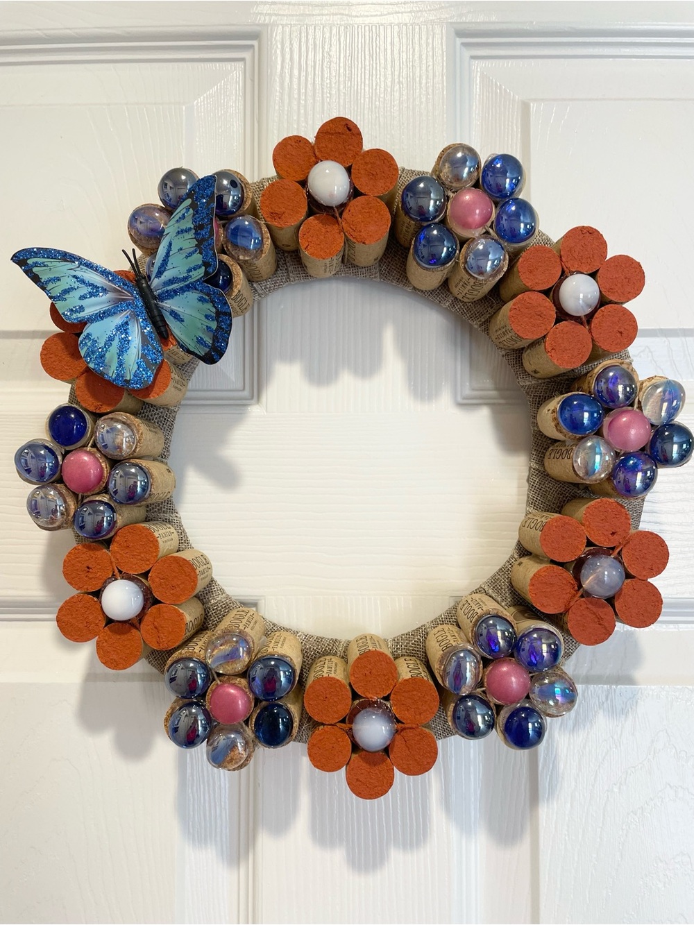 Hand Crafted Orange and Blue Cork Flower Wreath with Blue glittery Butterfly